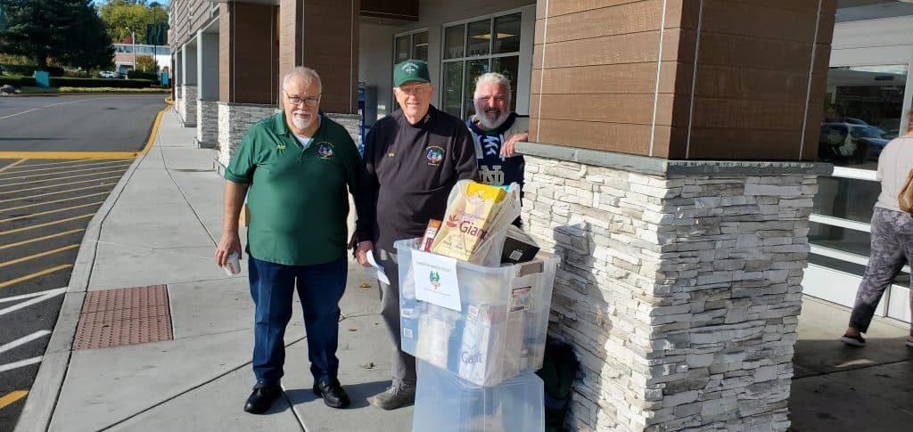 Hunger Project food drive chairman Bart Emanuel, left, Division President Greg Gibbons and Terry Riley outside Giant supermarket in Bull Run Plaza. 
